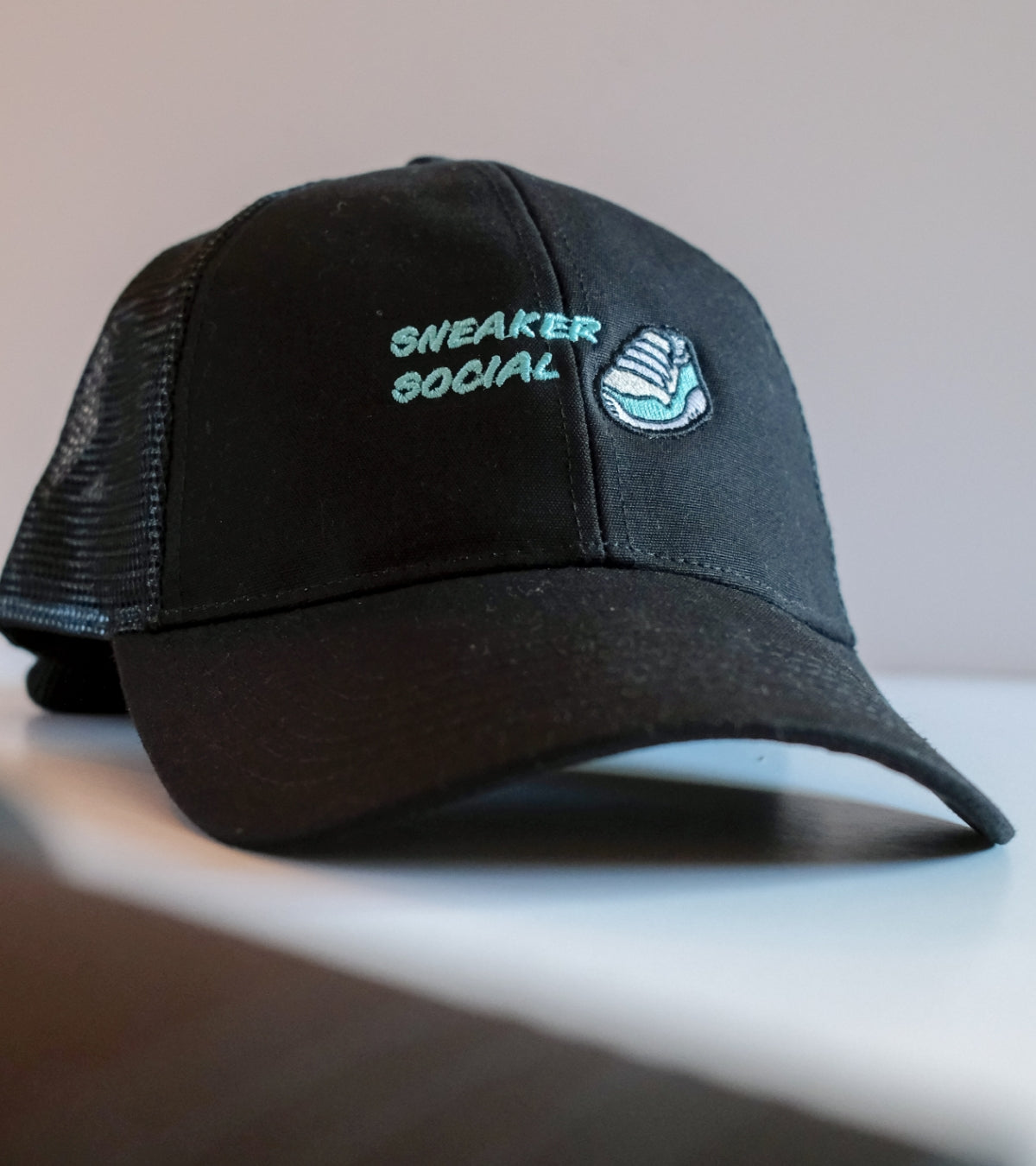 Shop the Sneaker Social Trucker Cap. Premium cotton peak and front, recycled polyester mesh, streetwear born in Northampton. Started off a dream, now a reality. UK shipping.