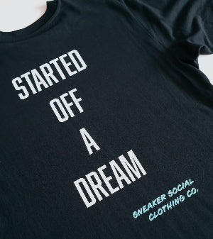 Black 240gsm relaxed fit t-shirt with white text 'STARTED OFF A DREAM' and 'SNEAKER SOCIAL CLOTHING CO.' on a white background